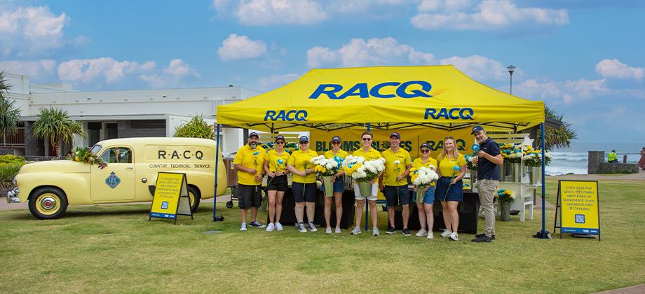 blooms burleigh staff standing in front of car