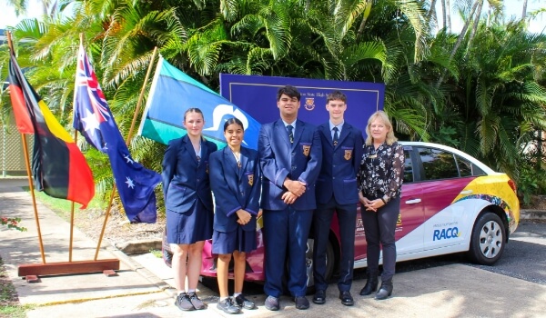 Students standing in front of RACQ donated car