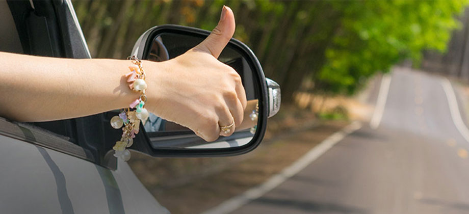 Hand out the window giving thumbs up