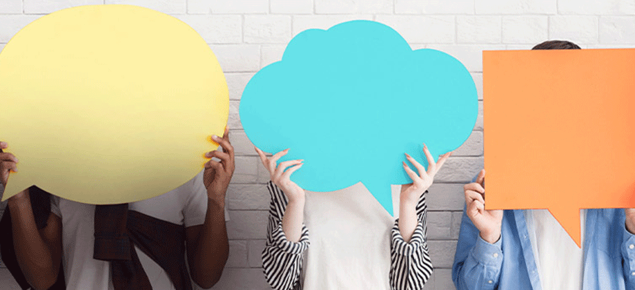Women holding up signs