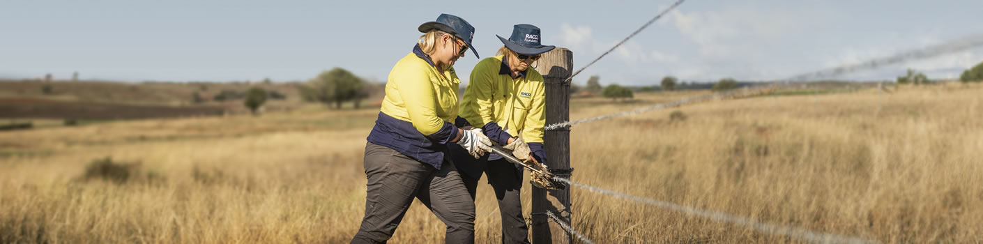 two-woman-tradie-workers-with-fence