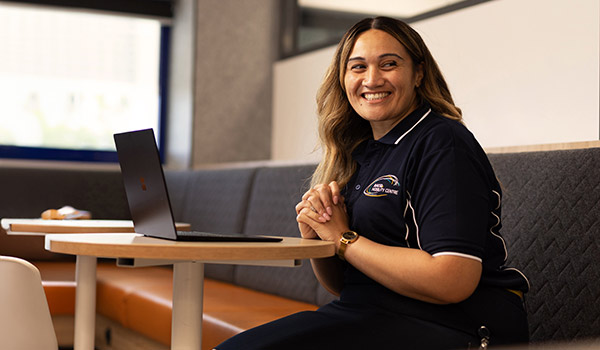 RACQ Mobility Centre staff with laptop in office