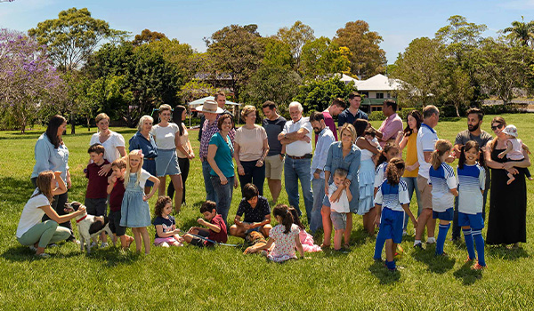 Community standing in park
