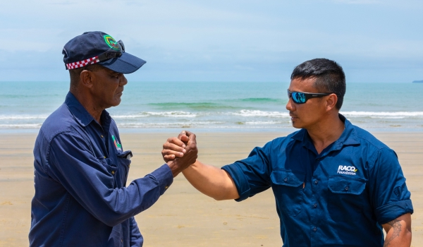 King Vincent from Yarrabah shaking hands with RACQ volunteer at the Yarrabah Community Assistance Project