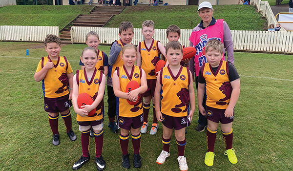 kids sport afl posing