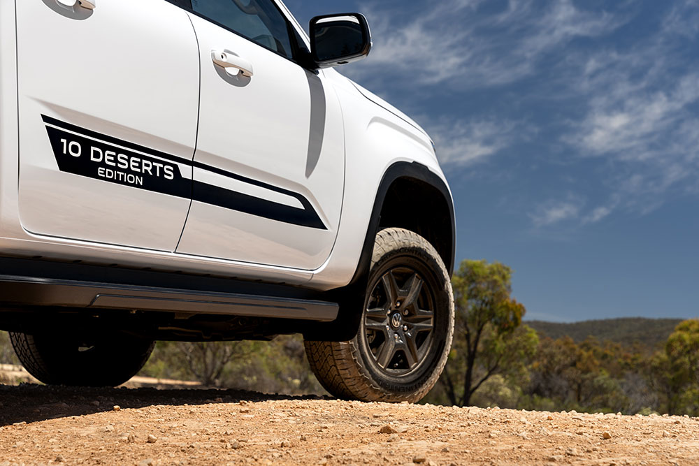 VW Amarok 10 Deserts Edition branding on side of vehicle.