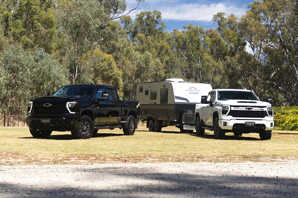 A pair of 2024 Silverado 2500 HD pickups.