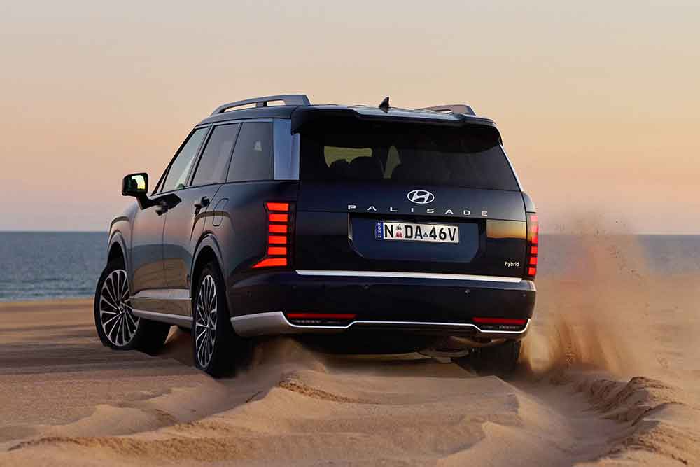 Hyundai Palisade Calligraphy Hybrid being driven on sand