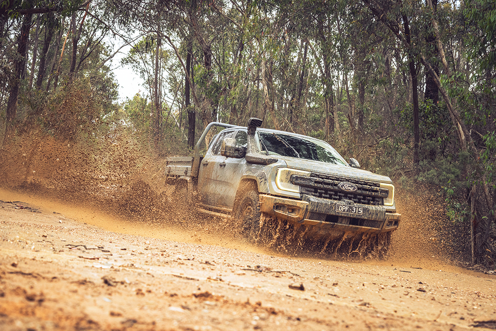 Ford Ranger Super Duty Double Cab Chassis driving through mud