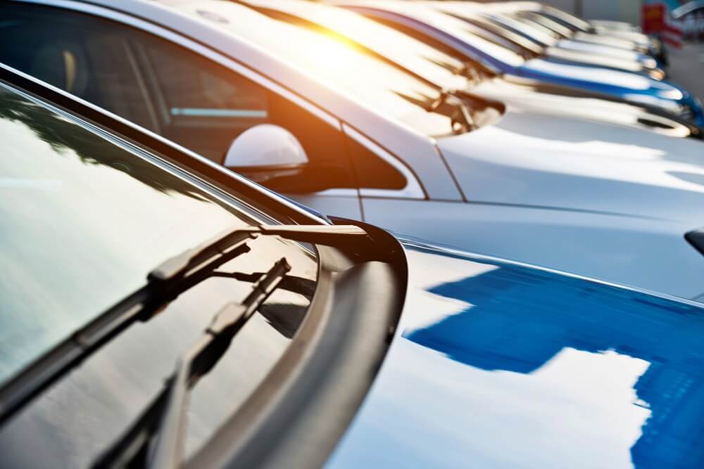 A row of new cars for sale.