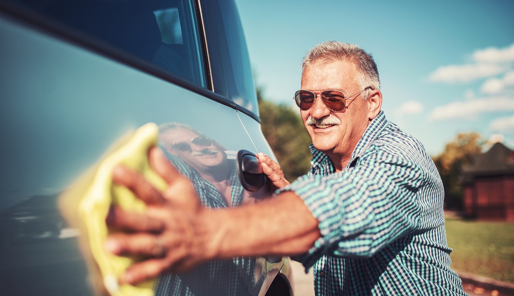 Man cleaning his car.