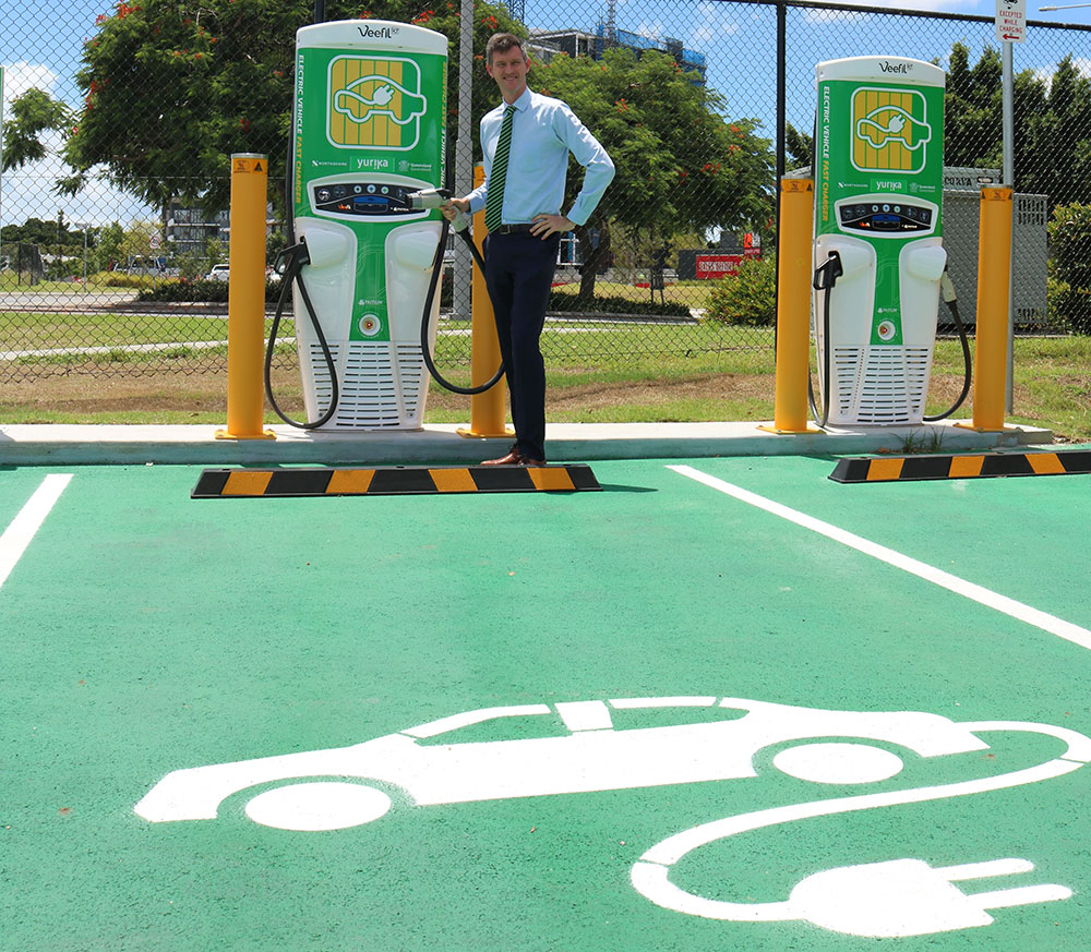 Transport Minister Mark Bailey at a Queensland Electric Super Highway charging station.