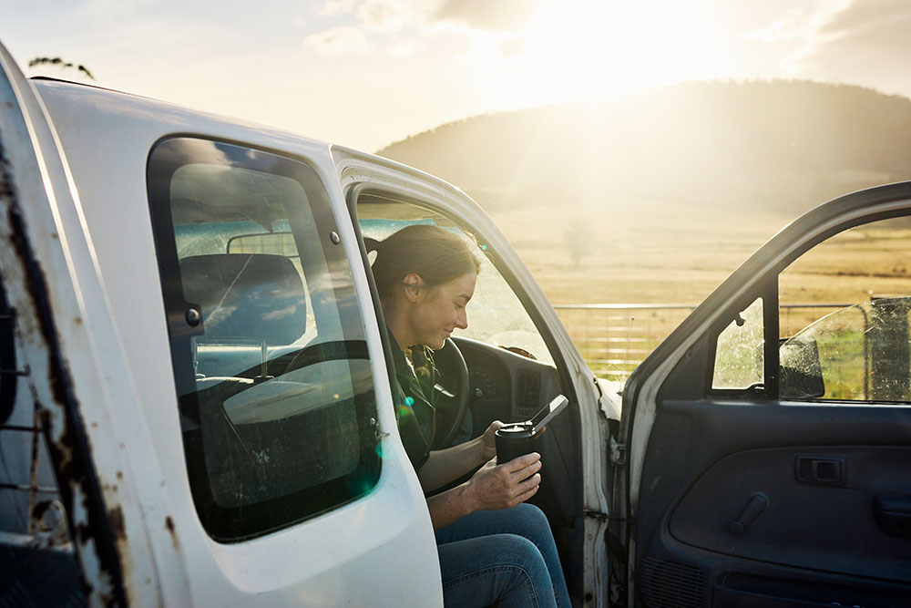 Lady sitting in car on her phone