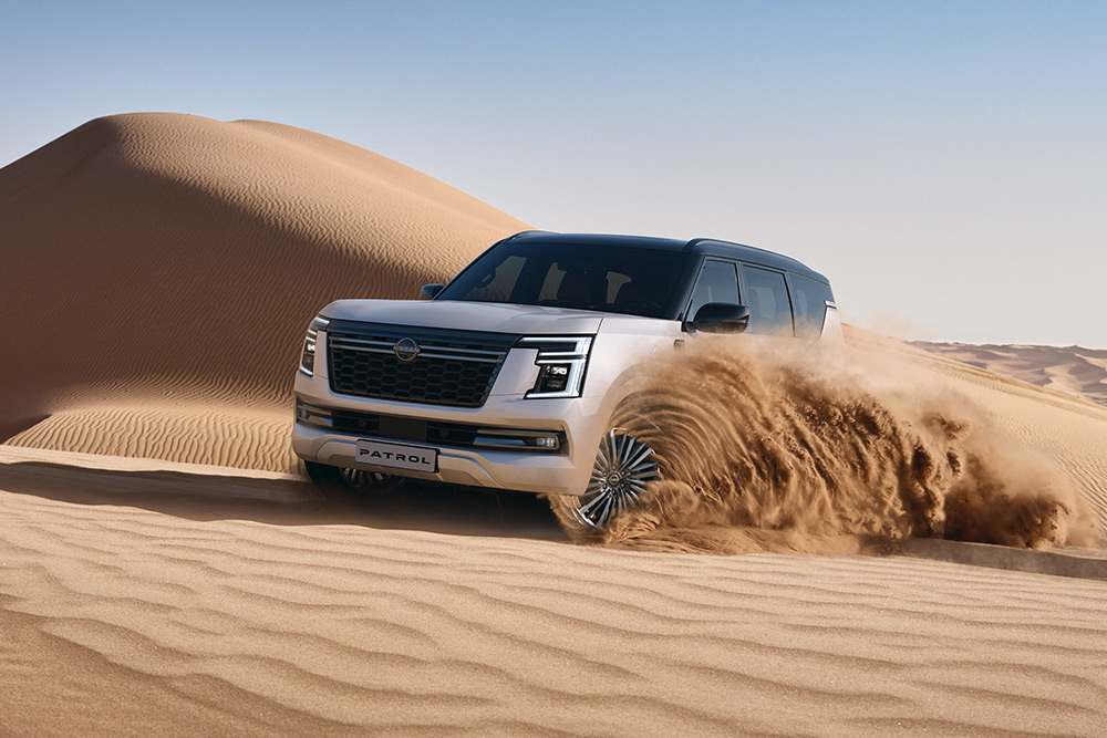 Seventh-generation Y63 Nissan Patrol churns up desert sands.