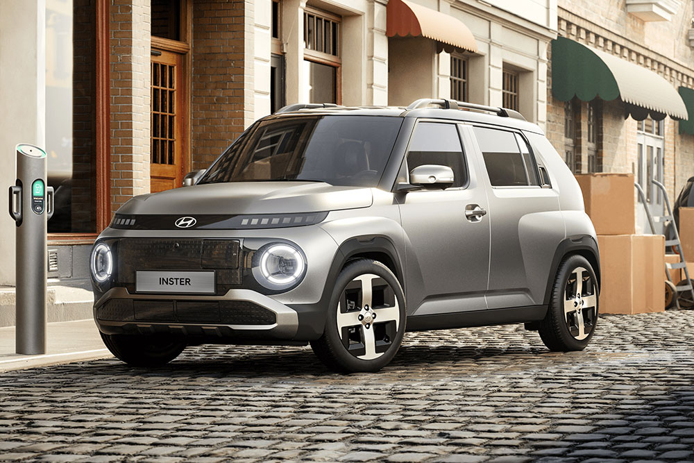 The Hyndai Inster parked on an urban streete.