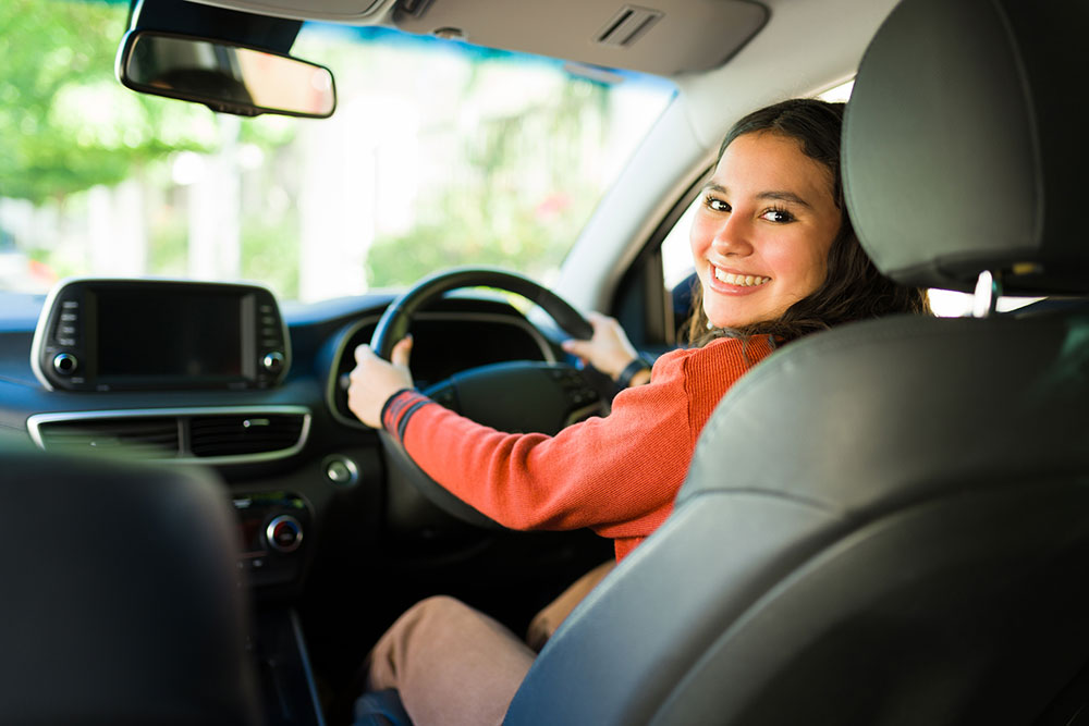 Young driver behind the wheel.