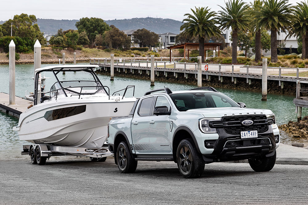 Ford Ranger PHEV ute towing a boat.
