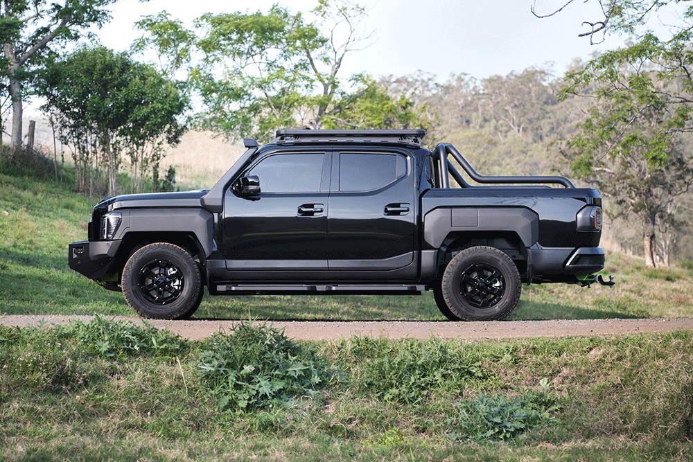 Profile view of Kia Tasman ute.