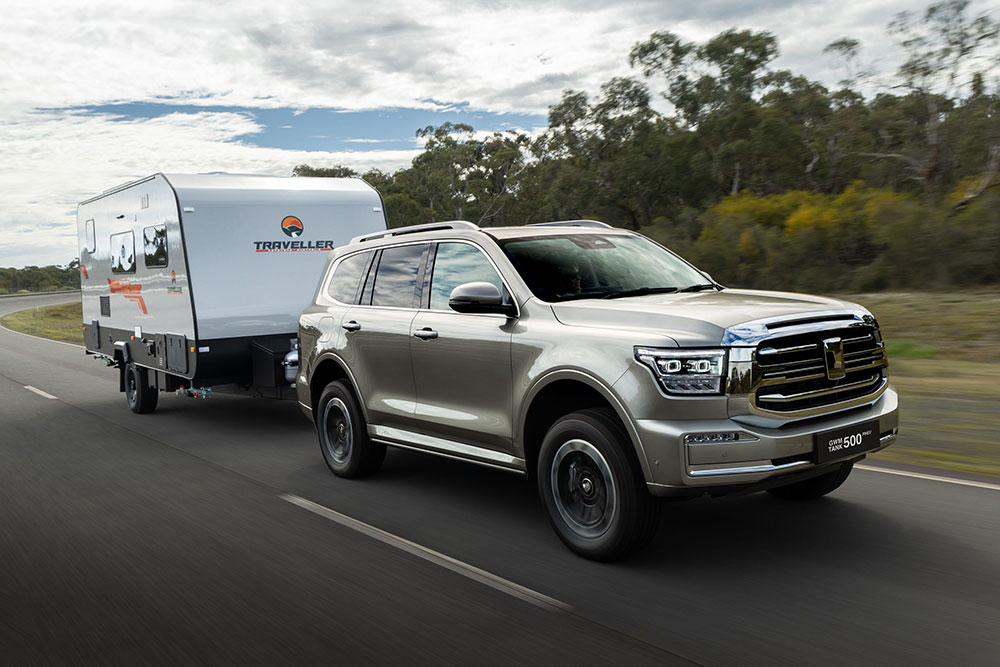 GWM Tank 500 Hi4-T plug-in hybrid SUV towing a caravan.