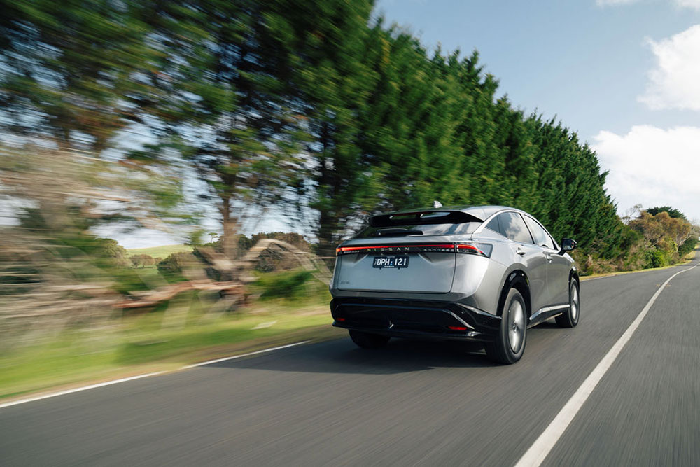 Nissan Ariya rear view on the road.