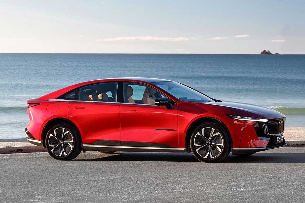 Mazda 6e side view with ocean backdrop