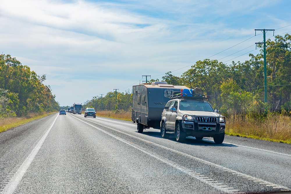 Car towing a caravan on a section of the Bruce Highway