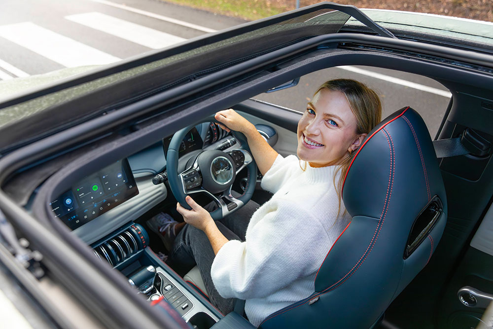 A member behind the wheel of a BYD Atto 3.