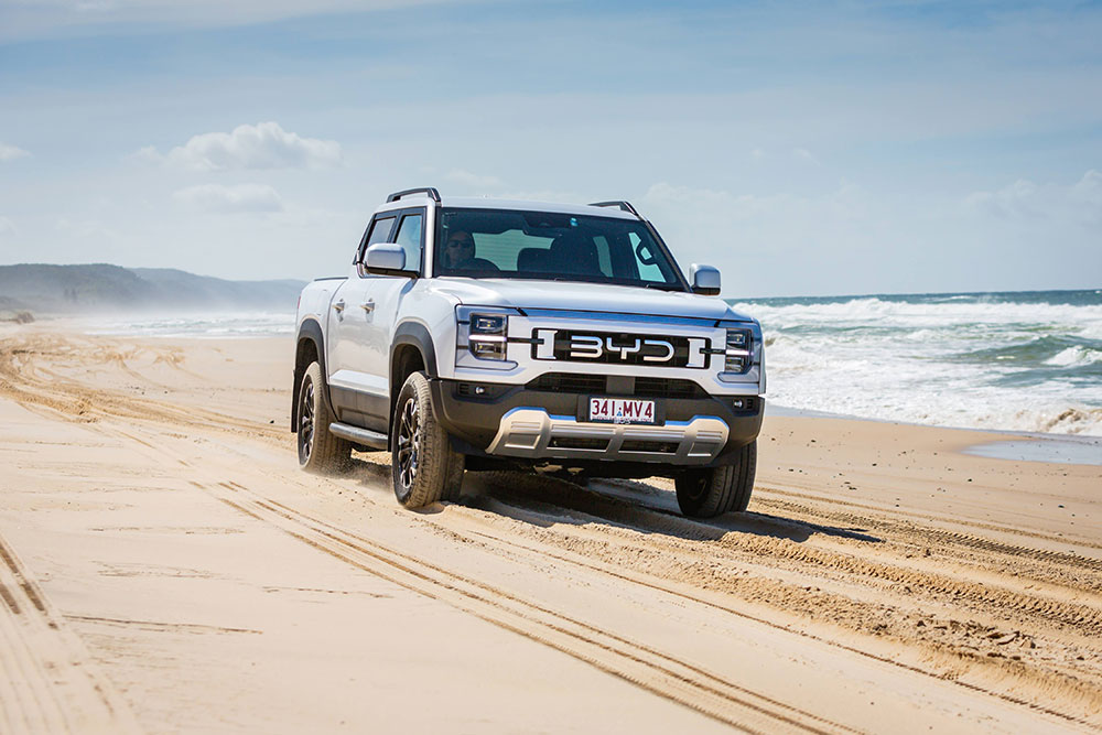 BYD Shark 6 ute driving on Noosa North Shore beach.