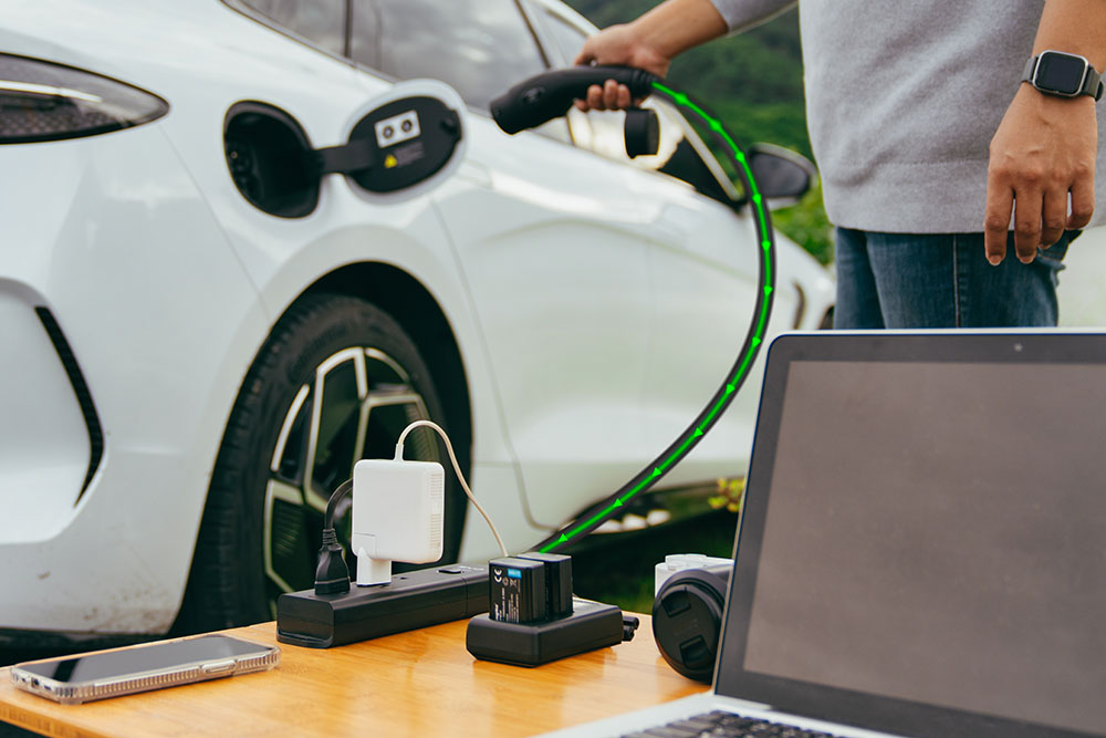 Man uses EV's Vehicle to Load function to power devices.