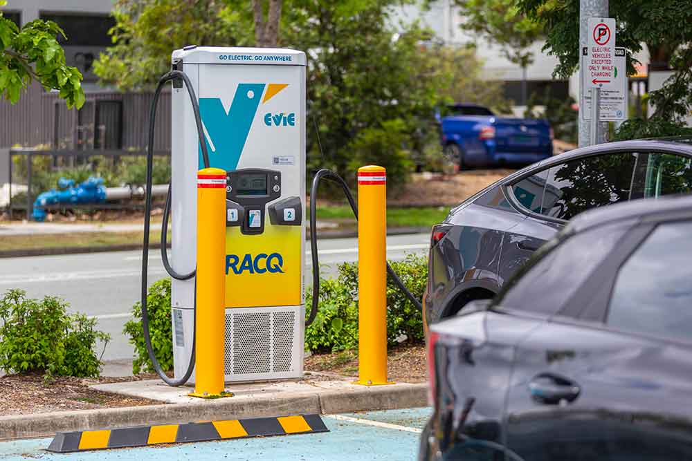 Vehicle recharging at Evie charging station.