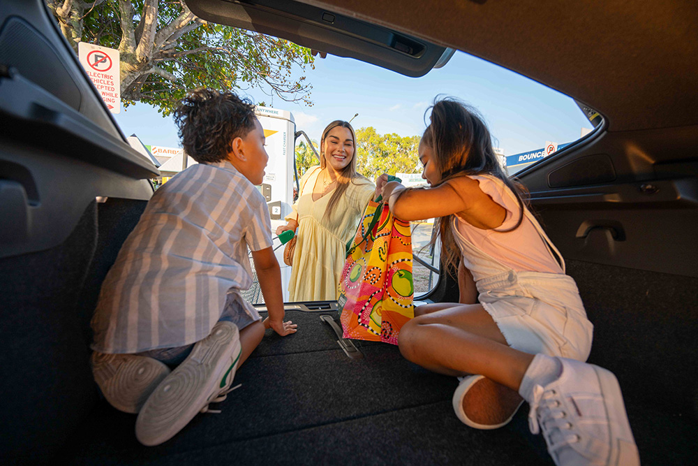 mother with son and daughter in car evie
