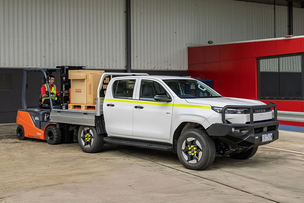 Toyota HiLux EV being loaded with boxes.
