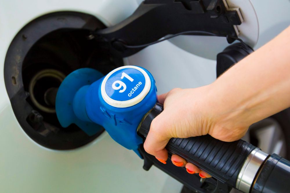 person filling up with unleaded