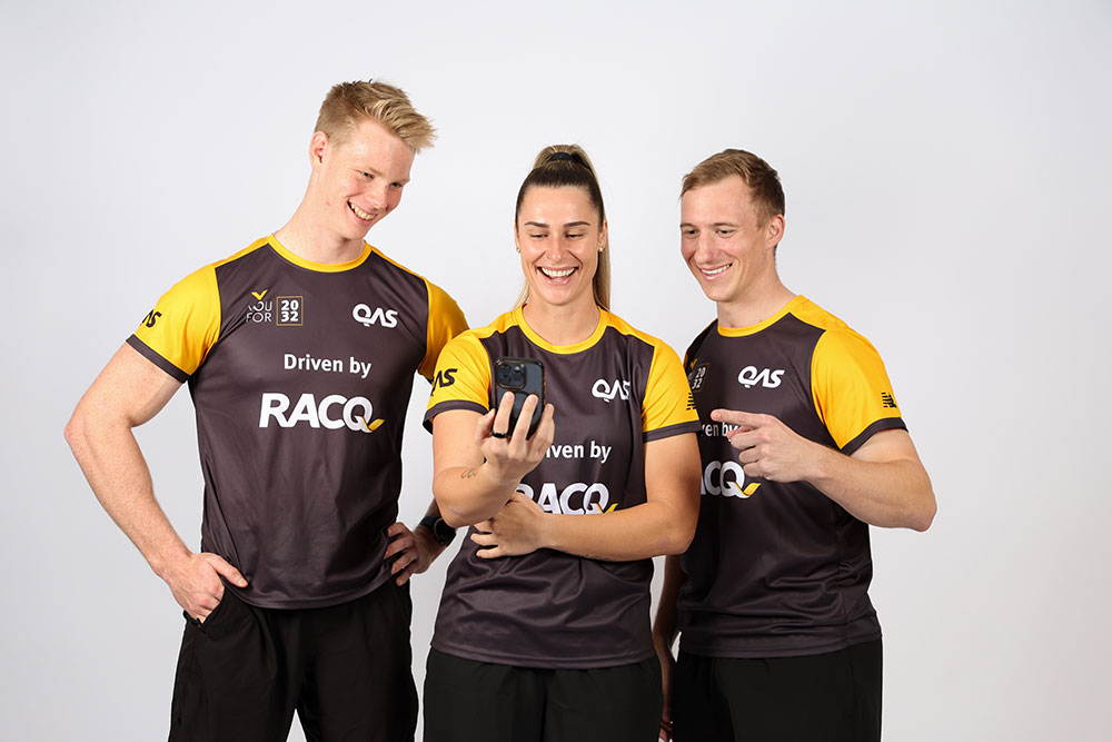 QAS athletes Mac Rogers (rowing), Natalya Diehm (BMX freestyle) and Korey Boddington (Para-cycling) check out  YouFor2032 Talent Search app, driven by RACQ.