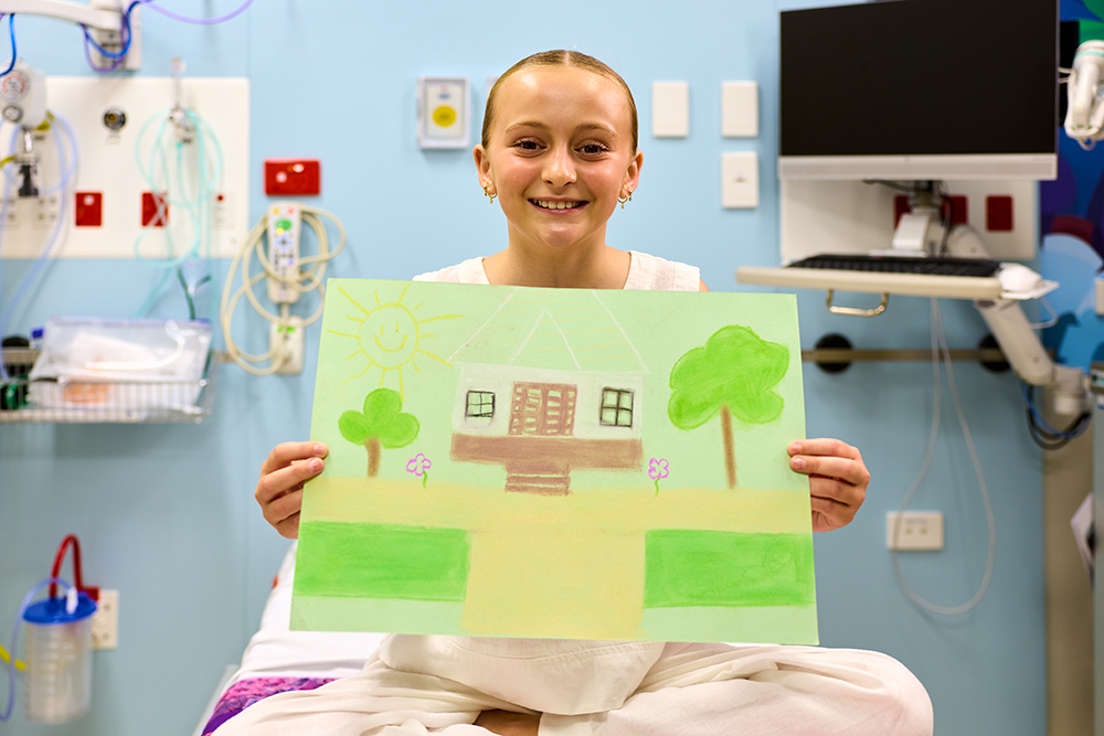 Evie Smith with the artwork she created.