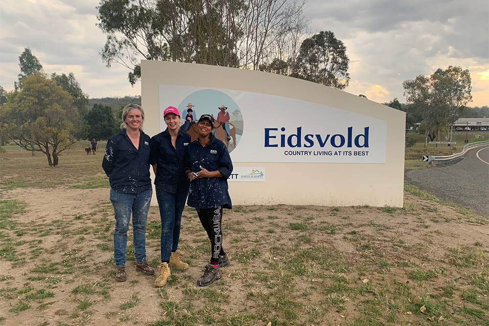 Foundation volunteers in front of Eidsfold sign