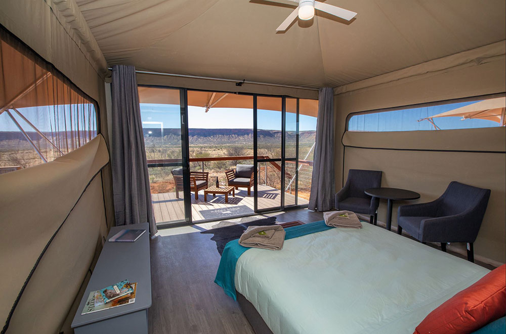 Bed iwth a view at Drover's Dream glamping at Kings Creek Station.