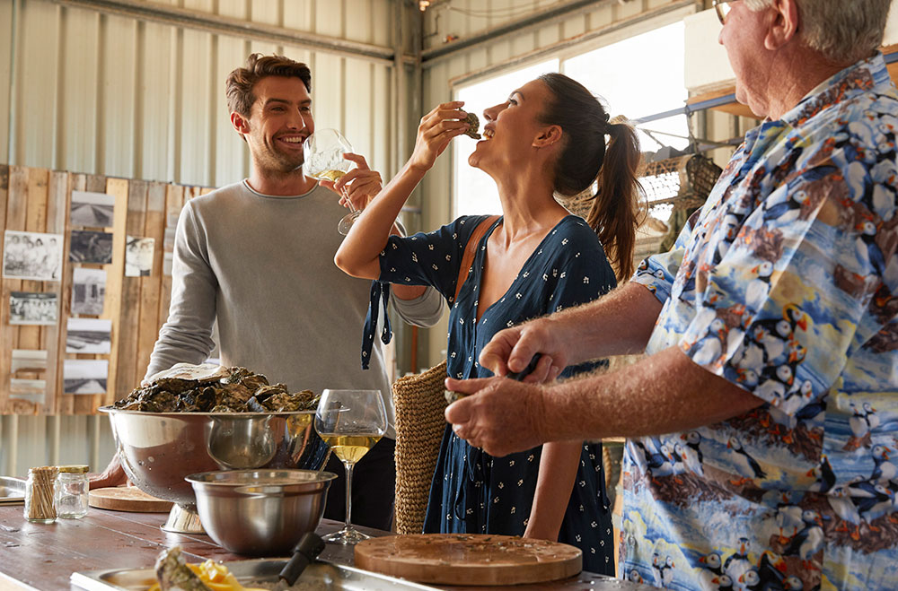 Couple at Jim Wild's Oysters, Greenwell Bay.