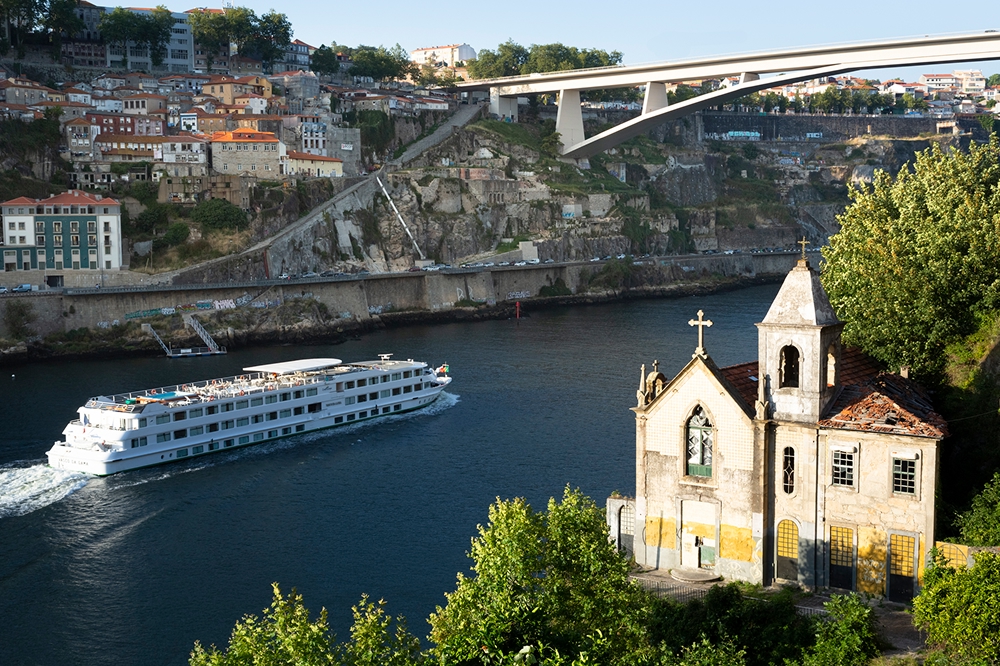 Cruise ship arriving at Porto by river Douro, Portugal