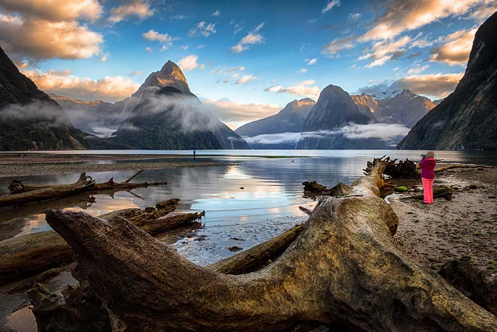 A photographer taking a picture at Milford Sound