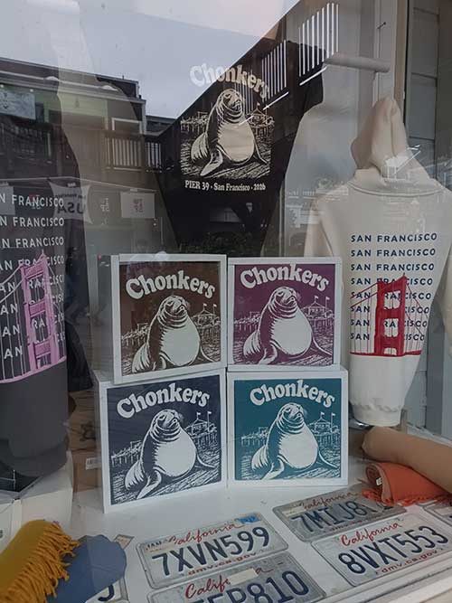 T-shirts with Chonkers the sea lion's image in a San Francisco store window