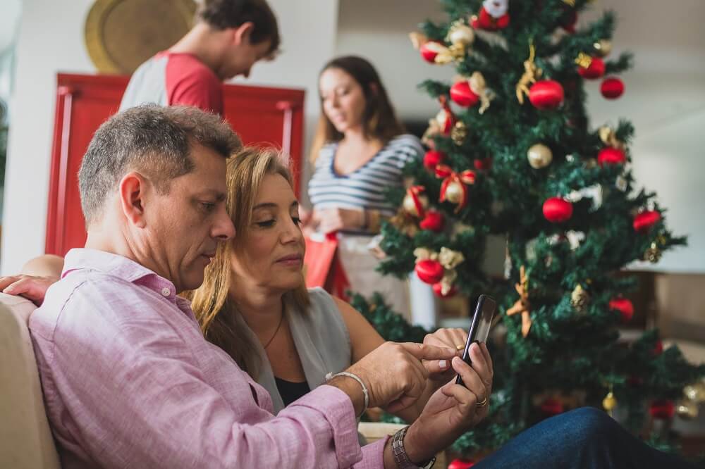 Parents looking at mobile phone