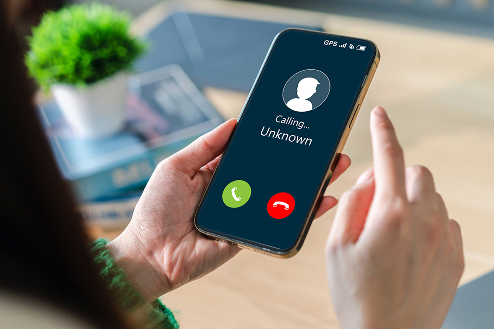 Image of mobile phone with call from unknown number.