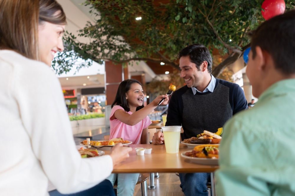 Family eating at food court