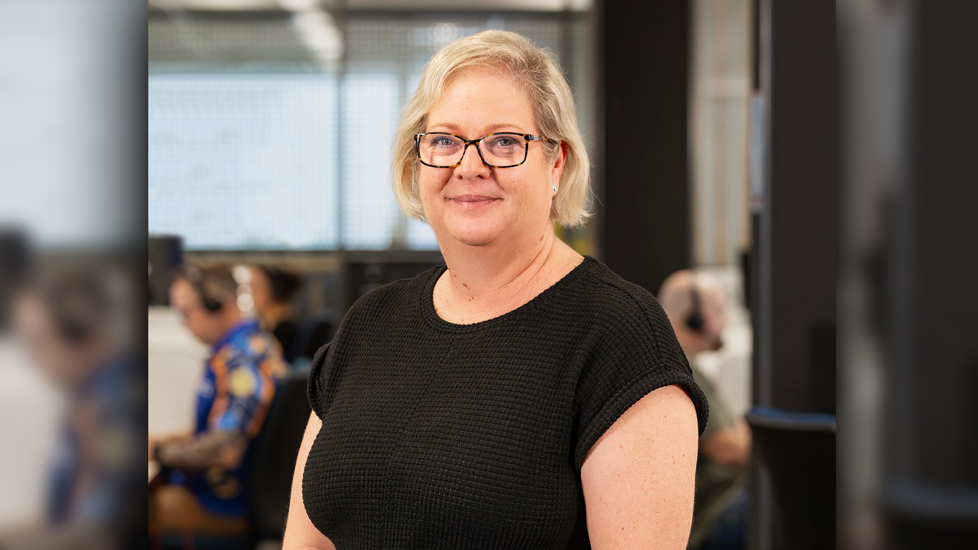 Woman standing in front of RACQ contact Centre