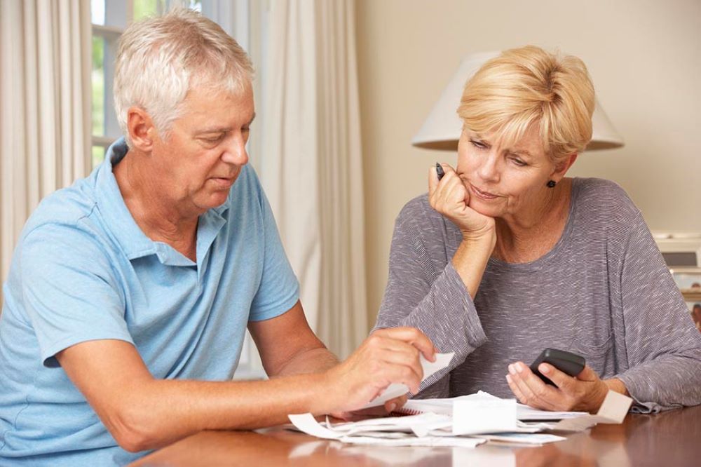 Retired couple looking at finances