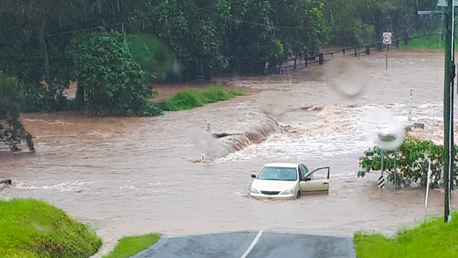 Car in flood waters.Credit Courier Mail