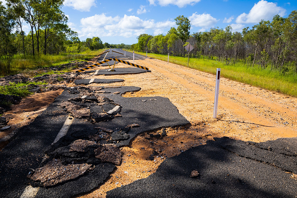Flood-damaged road in regional Queensland.