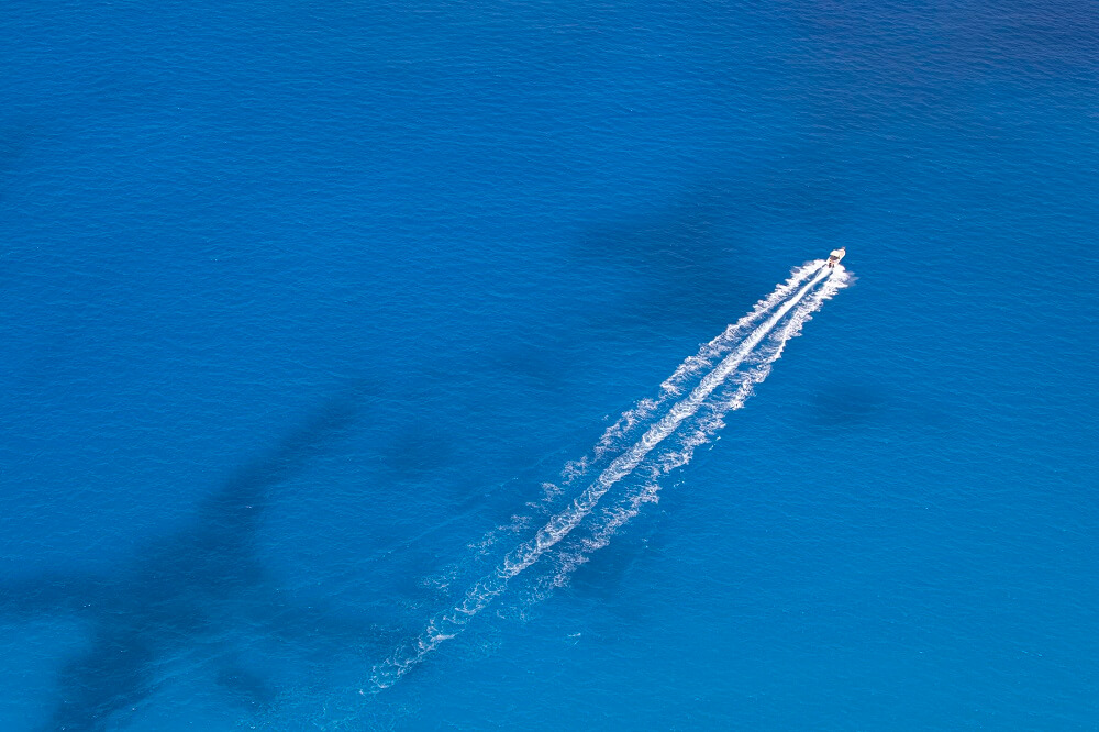 A boat travelling through the ocean.