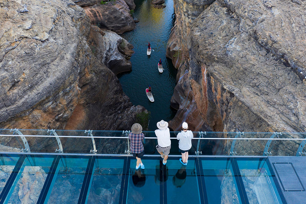 Watching stand-up paddleboarders in Cobbold Gorge.